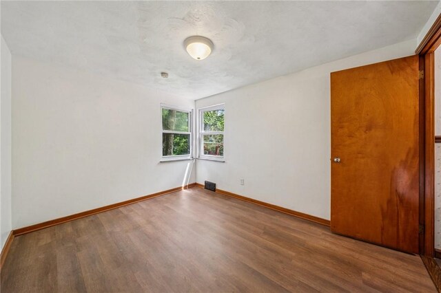 134 Hamilton Dr, Penn Hills, PA 15235 - unfurnished room with wood finished floors and baseboards