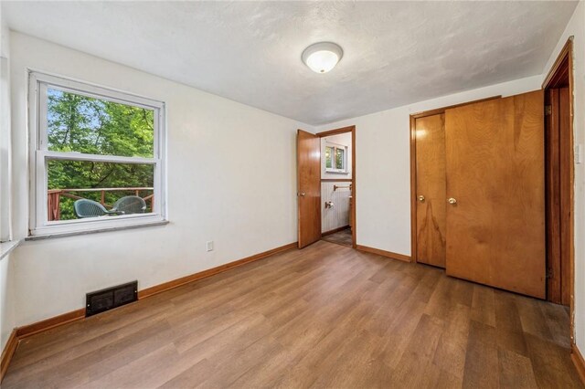 134 Hamilton Dr, Penn Hills, PA 15235 - unfurnished bedroom with light wood-style floors and baseboards