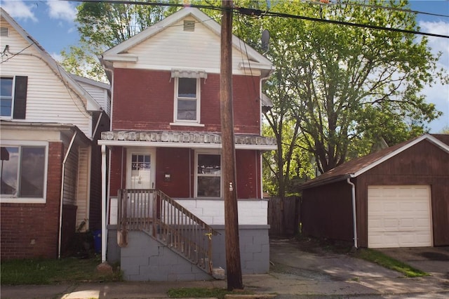 120 N 6th Ave, City Of But Nw, PA 16001 - view of front facade featuring brick siding, a garage, and an outdoor structure
