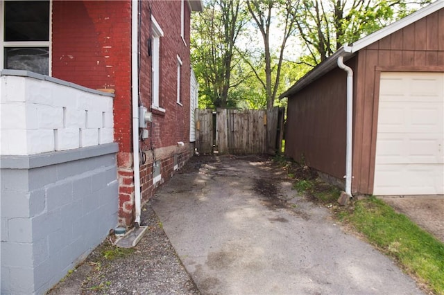 120 N 6th Ave, City Of But Nw, PA 16001 - view of property exterior featuring brick siding and a garage