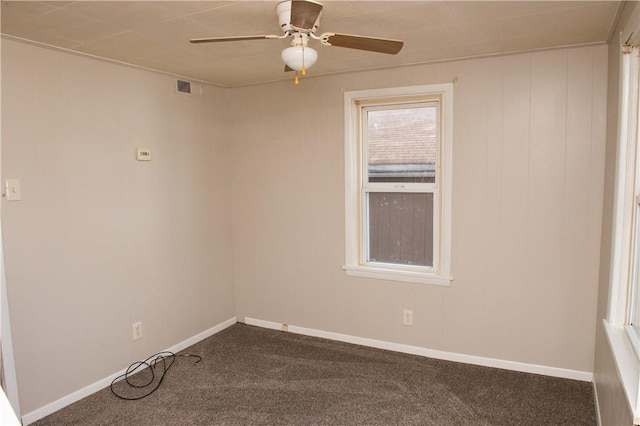 120 N 6th Ave, City Of But Nw, PA 16001 - spare room featuring a ceiling fan, dark colored carpet, and baseboards