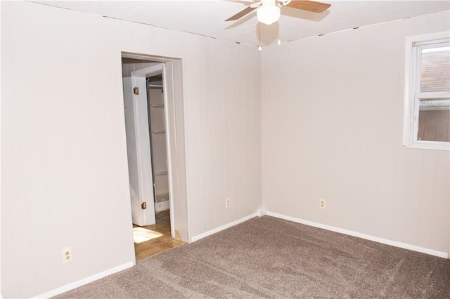 120 N 6th Ave, City Of But Nw, PA 16001 - carpeted empty room with ceiling fan, baseboards, and wood walls
