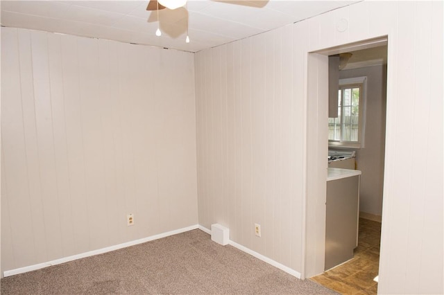120 N 6th Ave, City Of But Nw, PA 16001 - carpeted empty room with ceiling fan, baseboards, and wooden walls