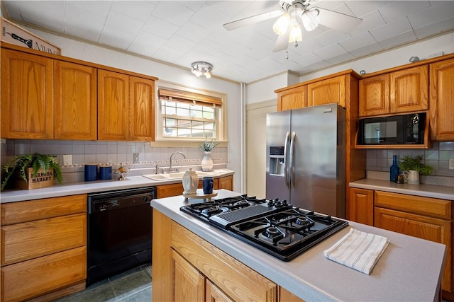 127 Bayard Pl, Shadyside, PA 15213 - kitchen with black appliances, a sink, decorative backsplash, and light countertops