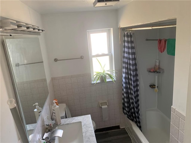 3003 Jersey St, Mckeesport, PA 15132 - bathroom with tile walls, toilet, shower / bath combination with curtain, vanity, and wood finished floors