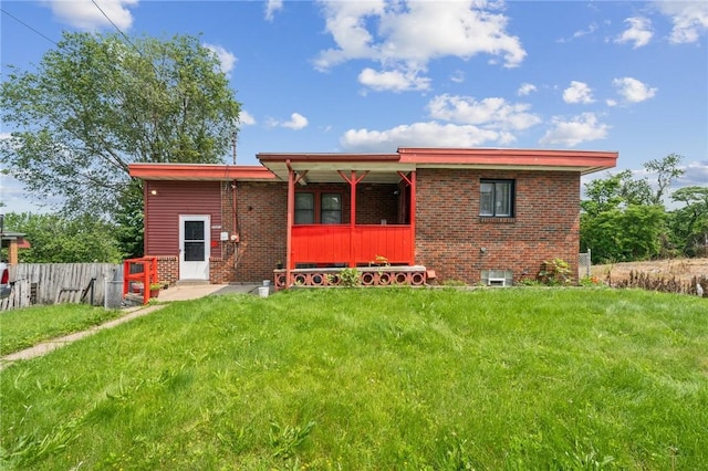 3003 Jersey St, Mckeesport, PA 15132 - rear view of property with brick siding and a porch