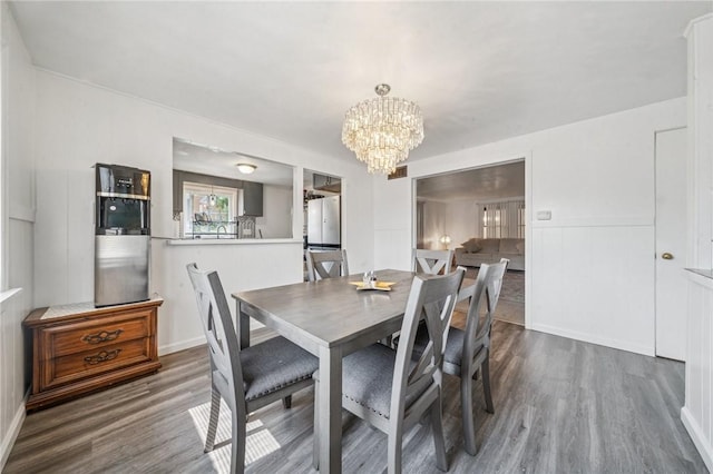 3003 Jersey St, Mckeesport, PA 15132 - dining space featuring wood finished floors and a chandelier