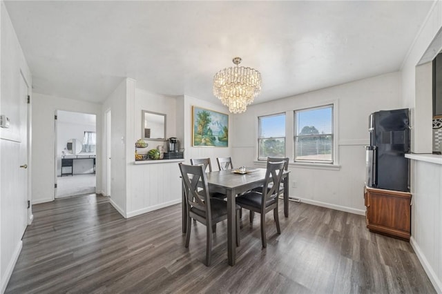 3003 Jersey St, Mckeesport, PA 15132 - dining room featuring a chandelier, dark wood-style flooring, and baseboards