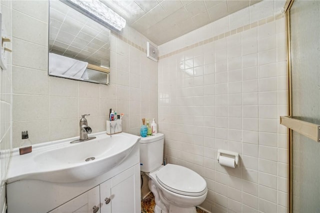 3003 Jersey St, Mckeesport, PA 15132 - bathroom featuring tile walls, vanity, and toilet