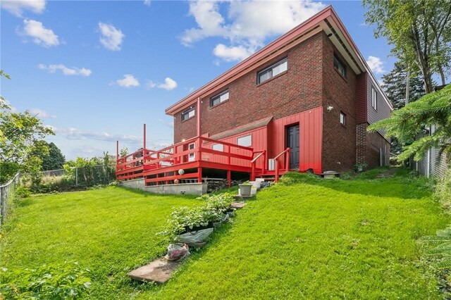 3003 Jersey St, Mckeesport, PA 15132 - rear view of house featuring a deck, brick siding, and board and batten siding