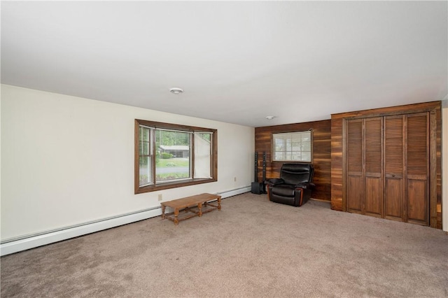 306 N Rd, Franklin Twp But, PA 16001 - carpeted living room with wooden walls and baseboard heating