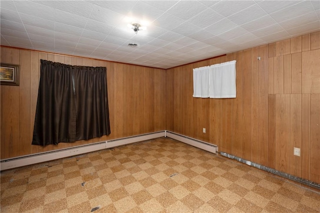 306 N Rd, Franklin Twp But, PA 16001 - unfurnished room featuring tile patterned floors, wooden walls, and a baseboard heating unit