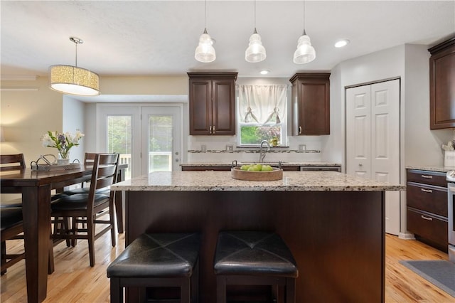 205 Emily Dr, Cranberry Twp, PA 16066 - kitchen featuring light wood finished floors, dark brown cabinetry, healthy amount of natural light, and recessed lighting