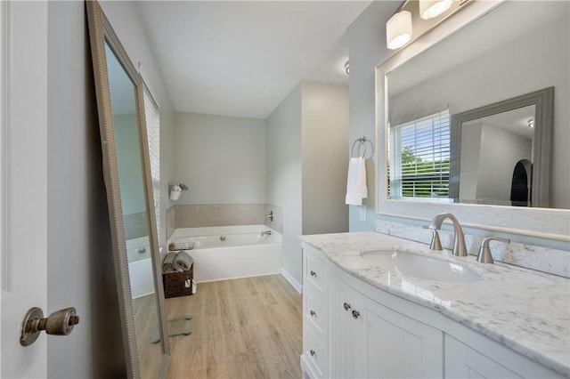 205 Emily Dr, Cranberry Twp, PA 16066 - full bath with vanity, a garden tub, and wood finished floors