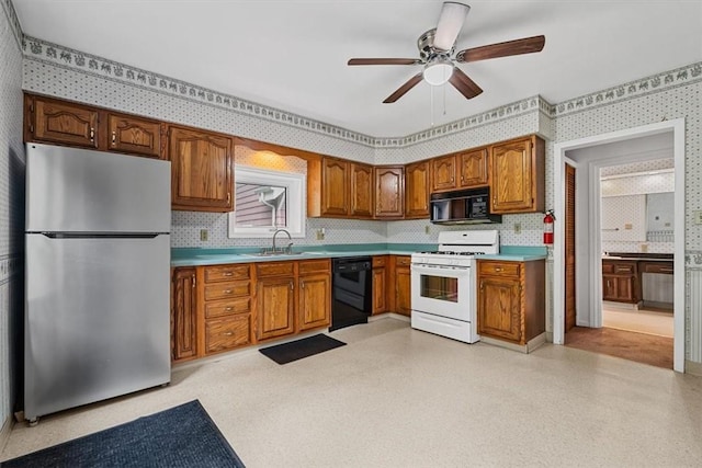 4072 Jordan St, South Heights, PA 15081 - kitchen featuring black appliances, wallpapered walls, a sink, light countertops, and a ceiling fan