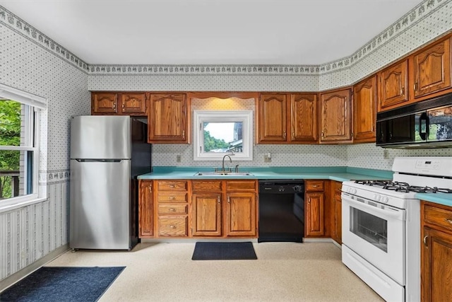 4072 Jordan St, South Heights, PA 15081 - kitchen with black appliances, wallpapered walls, a sink, and brown cabinets