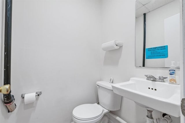 4072 Jordan St, South Heights, PA 15081 - half bathroom featuring toilet, a sink, a paneled ceiling, and baseboards