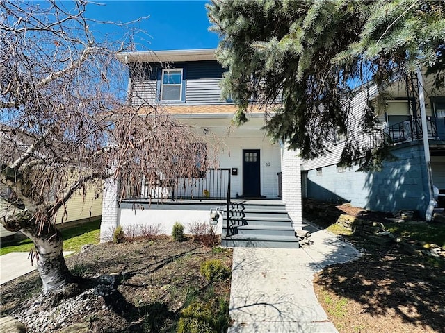 62 Laurel Ave, City Of Washington, PA 15301 - traditional style home featuring a porch and brick siding