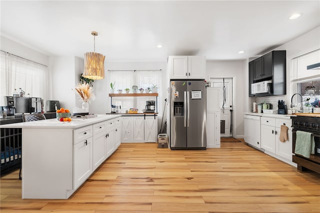 62 Laurel Ave, City Of Washington, PA 15301 - kitchen with white appliances, light wood finished floors, white cabinetry, a sink, and recessed lighting