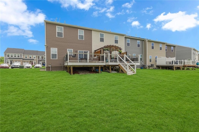 2054 Cade Dr, Potter Twp, PA 15061 - back of property with a wooden deck, a lawn, and a residential view