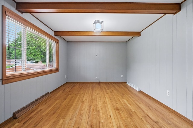 7965 Remington Dr, Mccandless, PA 15237 - unfurnished room featuring beam ceiling, light wood-style floors, wood walls, and a baseboard heating unit