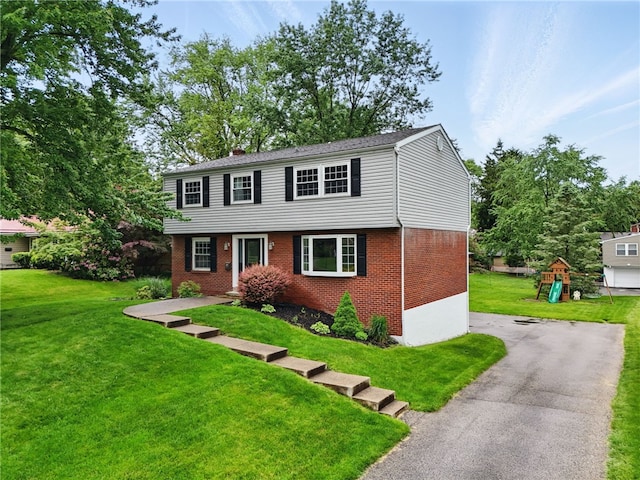 7965 Remington Dr, Mccandless, PA 15237 - colonial inspired home with brick siding, a front lawn, and a chimney