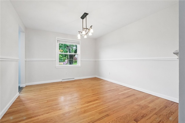 7965 Remington Dr, Mccandless, PA 15237 - spare room with light wood-style flooring, a chandelier, and baseboards