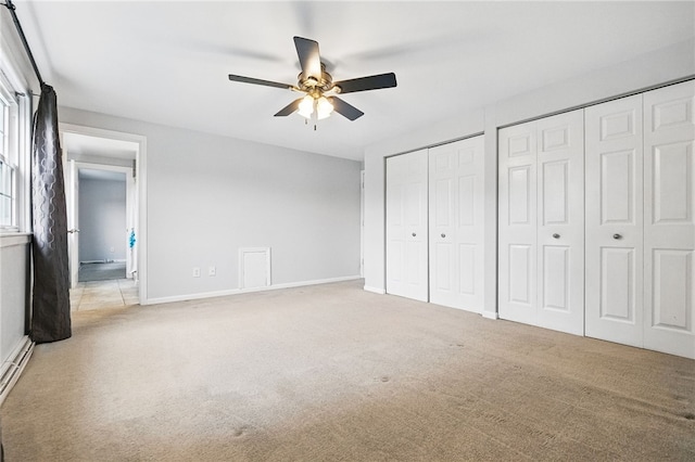 7965 Remington Dr, Mccandless, PA 15237 - unfurnished bedroom featuring multiple closets, carpet flooring, baseboards, and a ceiling fan