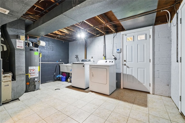7965 Remington Dr, Mccandless, PA 15237 - laundry room with gas water heater, washer and dryer, heating unit, and light tile patterned floors
