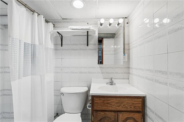5150 Friendship Ave, Friendship Park, PA 15224 - bathroom featuring tile walls, vanity, toilet, curtained shower, and a textured ceiling
