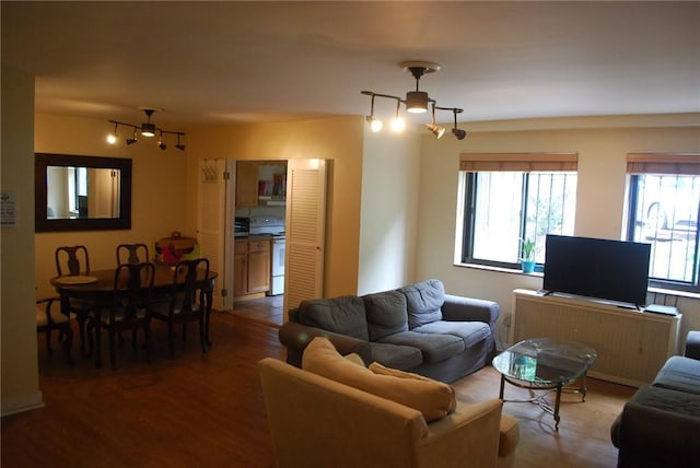 5120 5th Ave Unit 103, Shadyside, PA 15232 - living area featuring healthy amount of natural light, wood finished floors, and radiator