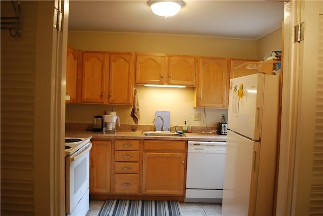 5120 5th Ave Unit 103, Shadyside, PA 15232 - kitchen featuring white appliances, a sink, light countertops, light tile patterned floors, and light brown cabinets