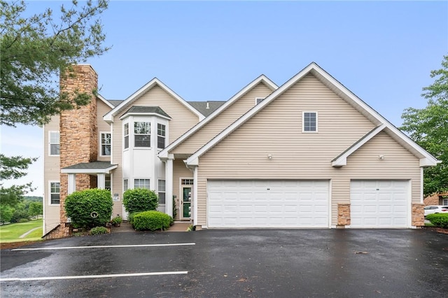 832 Eagle Pointe Dr, Cecil, PA 15317 - traditional-style house featuring driveway, a garage, and a chimney