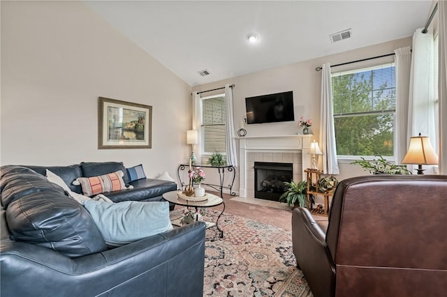 832 Eagle Pointe Dr, Cecil, PA 15317 - carpeted living room with vaulted ceiling and a tile fireplace