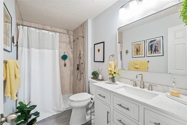 832 Eagle Pointe Dr, Cecil, PA 15317 - full bathroom featuring vanity, a textured ceiling, toilet, a shower with shower curtain, and wood finished floors