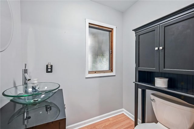 19 Ruth St, Hempfield Twp Mer, PA 16125 - half bath featuring wood finished floors, toilet, vanity, and baseboards
