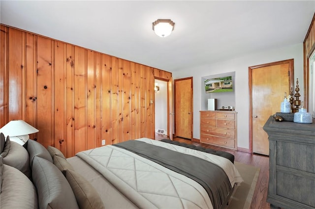 19 Ruth St, Hempfield Twp Mer, PA 16125 - bedroom with wood finished floors and wooden walls