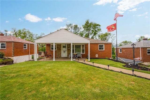 260 Bluemont Dr, West Mifflin, PA 15122 - rear view of house with a yard, brick siding, and a patio area