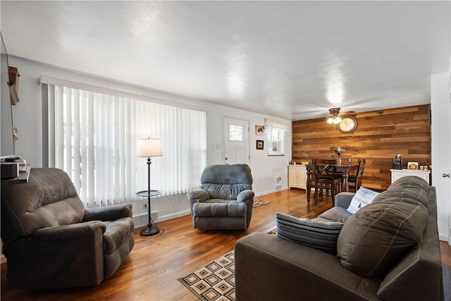 260 Bluemont Dr, West Mifflin, PA 15122 - living room with ceiling fan, wood walls, and wood finished floors