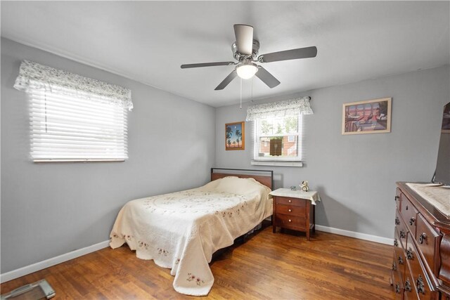 260 Bluemont Dr, West Mifflin, PA 15122 - bedroom with baseboards, wood finished floors, and a ceiling fan