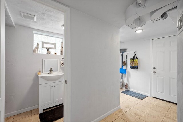 260 Bluemont Dr, West Mifflin, PA 15122 - foyer featuring light tile patterned floors and baseboards