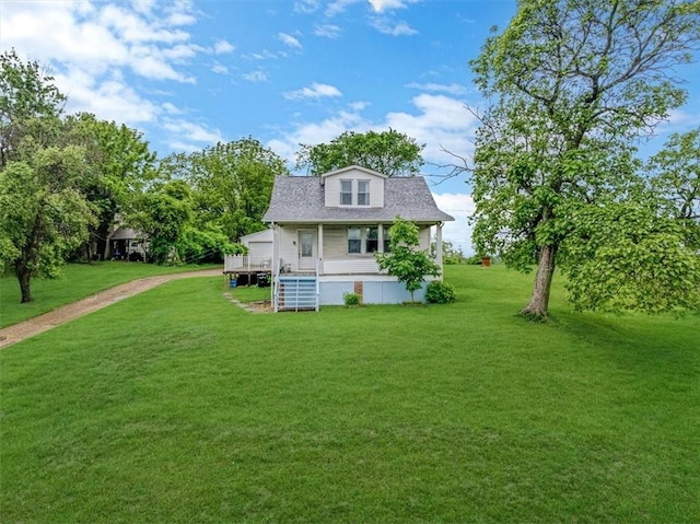 1675 Clairton Rd, West Mifflin, PA 15122 - back of house featuring a porch, a yard, a shingled roof, and dirt driveway