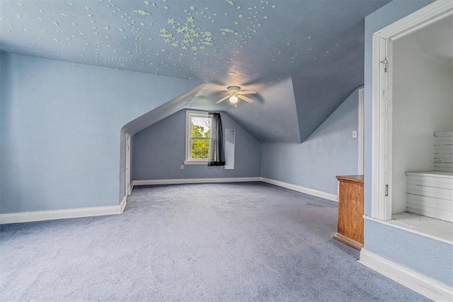 1675 Clairton Rd, West Mifflin, PA 15122 - additional living space with baseboards, vaulted ceiling, carpet floors, and a ceiling fan