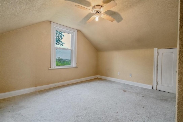 1675 Clairton Rd, West Mifflin, PA 15122 - bonus room featuring a textured ceiling, carpet, lofted ceiling, ceiling fan, and baseboards
