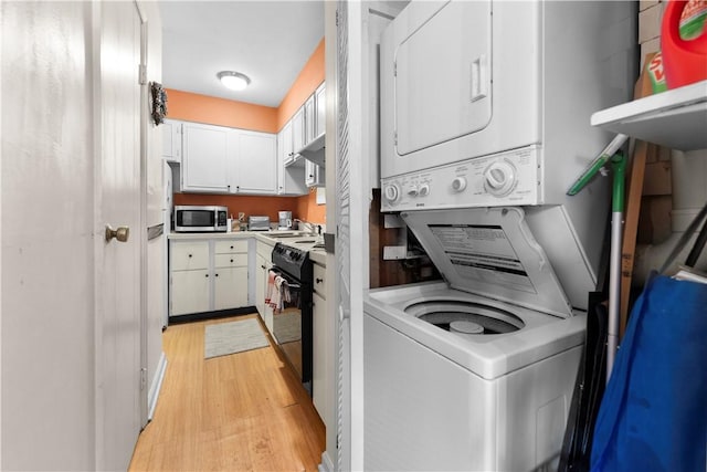 126 Jamestown Ct Unit C, Scott Twp Sal, PA 15216 - washroom with stacked washing machine and dryer and light wood-style flooring