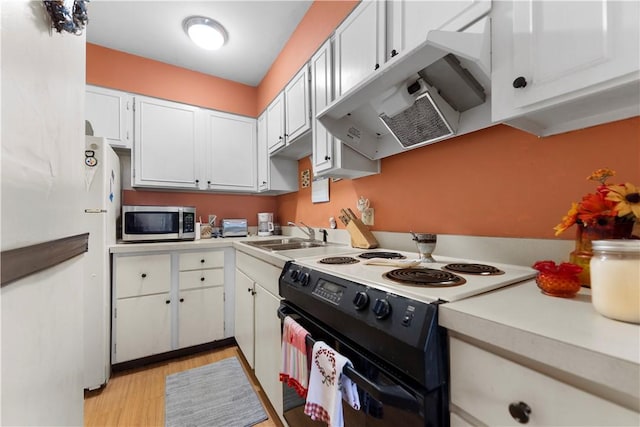 126 Jamestown Ct Unit C, Scott Twp Sal, PA 15216 - kitchen with stainless steel microwave, electric range, a sink, light countertops, and light wood finished floors