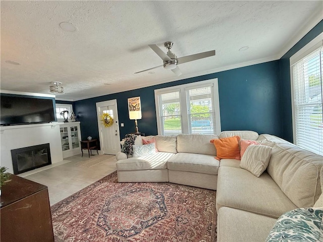 410 E Meyer Ave, New Castle/2Nd, PA 16105 - living area featuring a textured ceiling, a glass covered fireplace, a ceiling fan, and ornamental molding