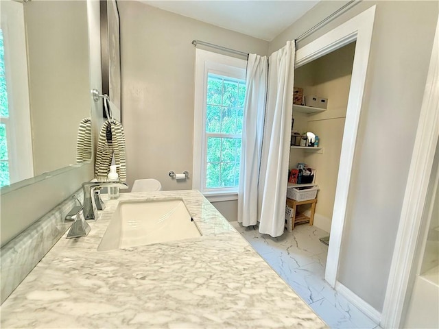 410 E Meyer Ave, New Castle/2Nd, PA 16105 - bathroom with marble look tiles, baseboards, and vanity