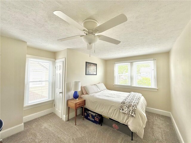 410 E Meyer Ave, New Castle/2Nd, PA 16105 - bedroom featuring a textured ceiling, baseboards, carpet flooring, and a ceiling fan