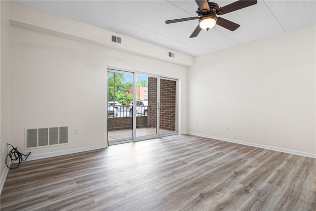 5600 Munhall Rd Unit 201, Squirrel Hill, PA 15217 - unfurnished room featuring wood finished floors, baseboards, and a ceiling fan